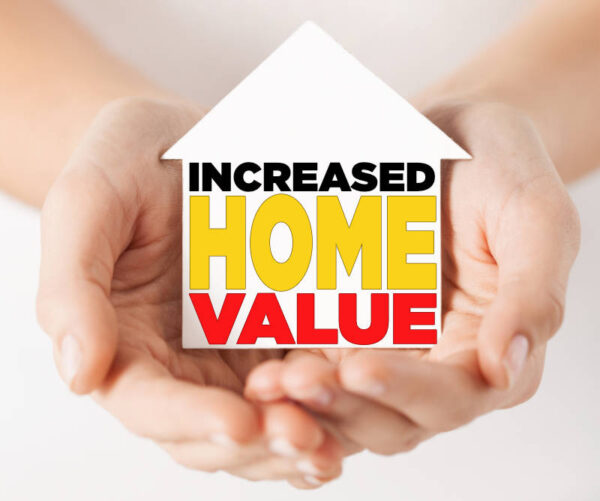 hands holding white paper house