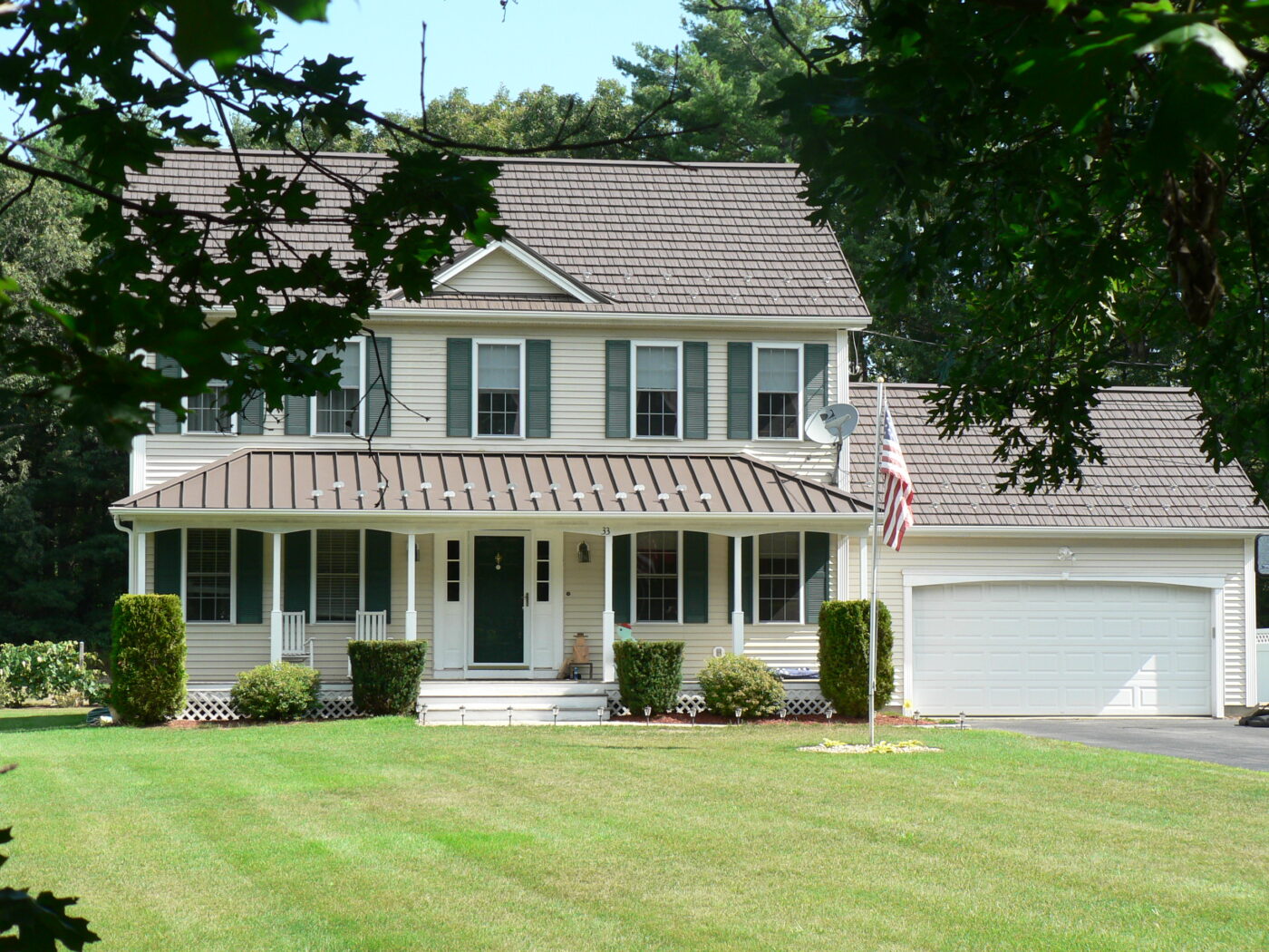 shake and standing seam metal roofing on American home