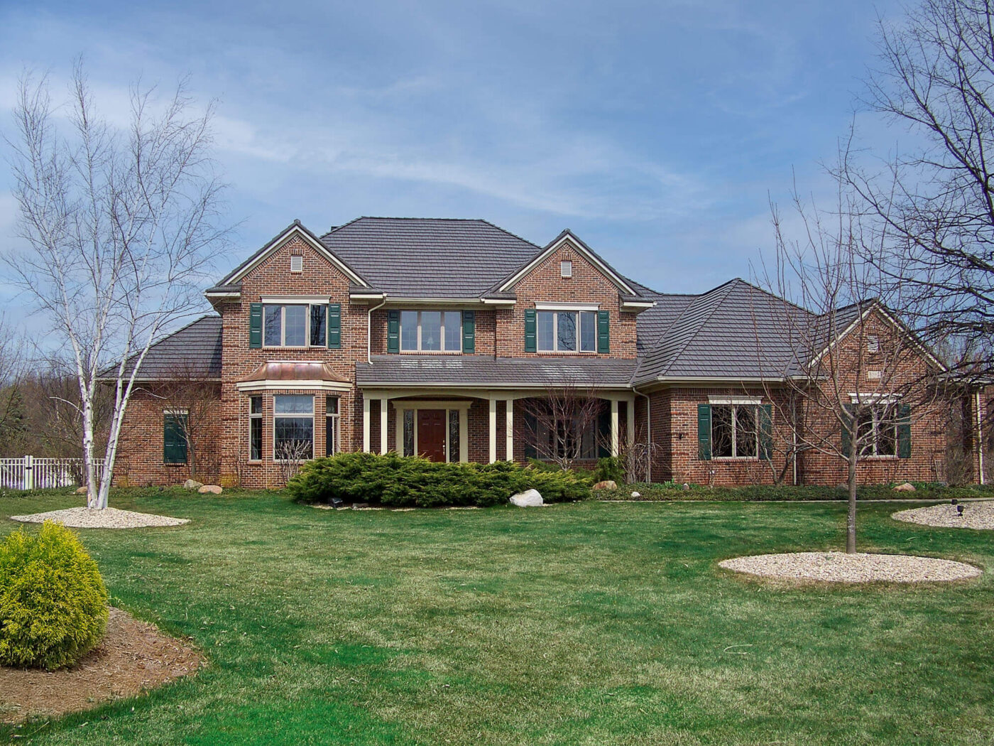 rustic shingle metal roofing brick house