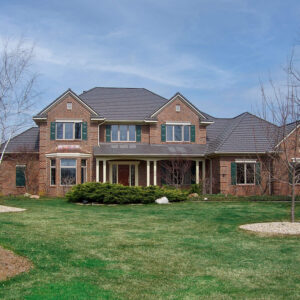 rustic shingle metal roofing brick house