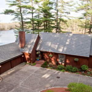 rustic shingle metal roofing lake house